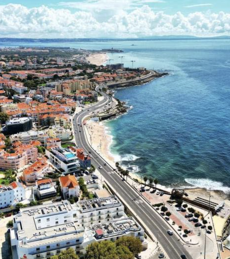 Golden beach at Carcavelos with surfers